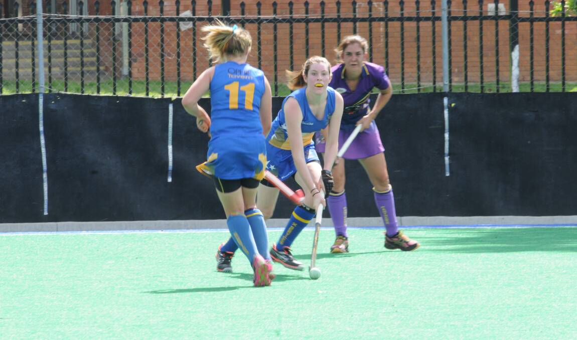 WORKHORSE: Rachel Pengilly looks to move the ball forward for Ex-Services. Pengilly was one of the best on ground, despite her team losing 6-0.
Photo: LUKE SCHUYLER 0308lshockey1