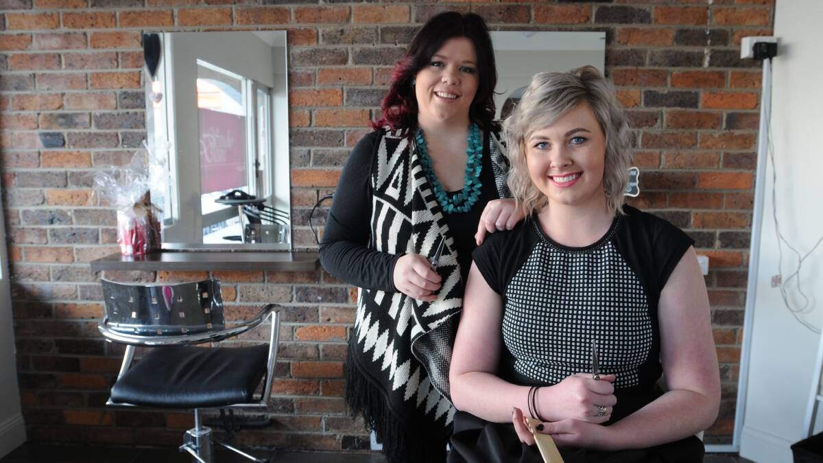 HAPPY AS PUNCH: Studio Desire owner Teagan Mooney and senior stylist Jemma Tooney. Miss Mooney says making people feel good about themselves is a highlight of being a hairdresser. Photo: STEVE GOSCH