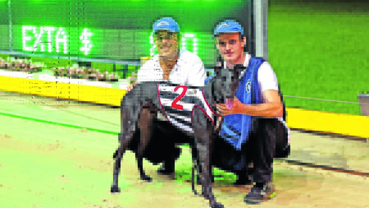 WINNERS ARE GRINNERS: Shakey Jakey is flanked by trainer Dave Pringle (left) and handler Jacob Burke. 
Photo: CRAIG YOULL 