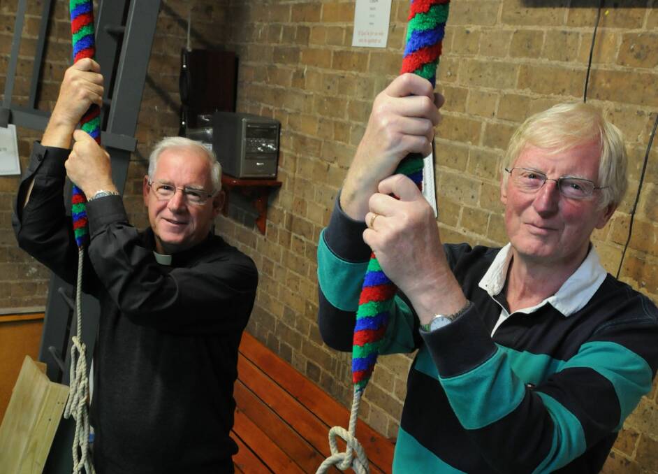 LEARNING THE ROPES: Archdeacon Frank Hetherington and Jim Woolford test the bells ahead of Saturday’s full peal.
Photo: STEVE GOSCH 0414sgbells1 