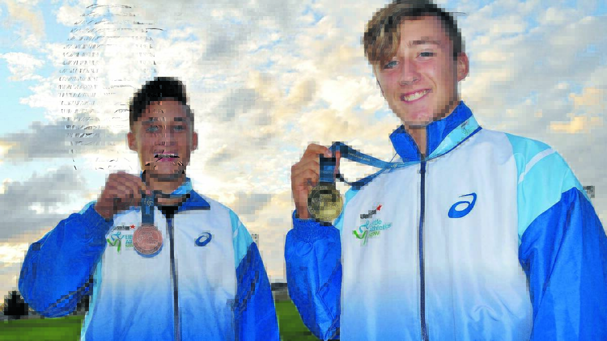 MEDAL OF HONOUR: Ollie Keegan and Jackson Willis won bronze and gold medals respectively at last week's ASICS Australian Little Athletics Championships in Adelaide.
 Photo: NICK McGRATH 0502nmmedal4