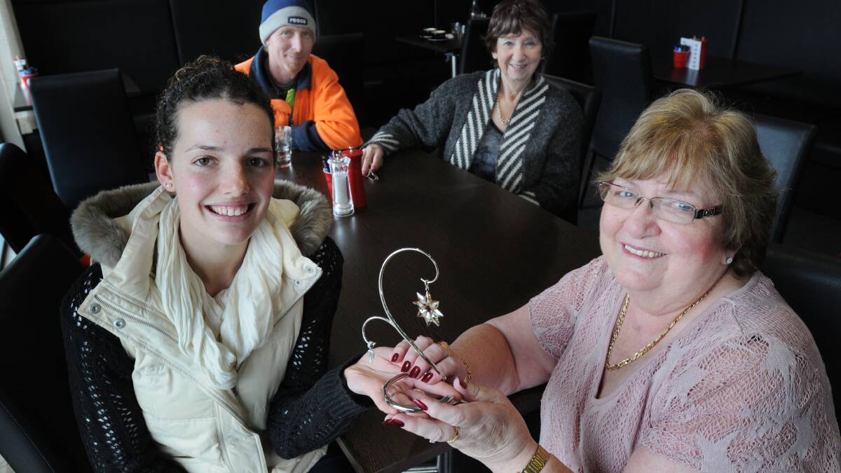 SPECIAL GIFT: Marilyn Buttsworth (right) thanks Jenna McAtamney who gave her life-saving CPR. Mrs Buttsworth’s son Derek and her sister Carolyn Russell look on. 
Photo: STEVE GOSCH 0724sglife3