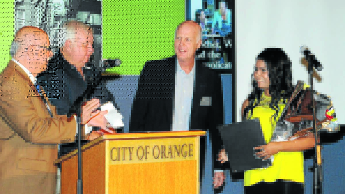 WELL DONE: Orange deputy mayor Chris Gryllis, Orange councillor Ron Gander and Neil Jones congratulate Atahlia Sutherland for her outstanding performing arts achievements at a civic reception on Friday night. 
Photo: STEVE GOSCH 0227sgyouthaward
