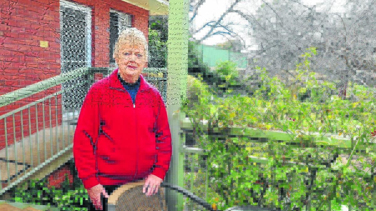 SATISFIED: Marcia Thorp believes councillors heard her concerns before they reduced the height of a golf cart storage shed on the neighbouring Duntryleague property. 
Photo: JUDE KEOGH 0812rowanst2