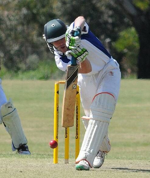 TOP SCORE: Blue Mountains batsman Alex Crowther plays a straight bat during his innings of 79 against Mudgee yesterday. 
Photo: STEVE GOSCH 1019sgcrick6