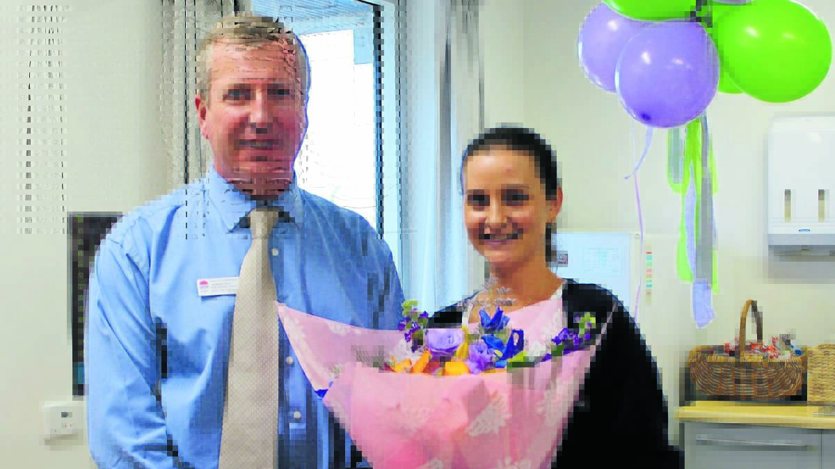 BEST IN THE REGION: Western NSW Local Health District director of nursing and midwifery Adrian Fahy congratulates Orange midwife Elide Newton who was named as the health district’s Midwife of the Year.