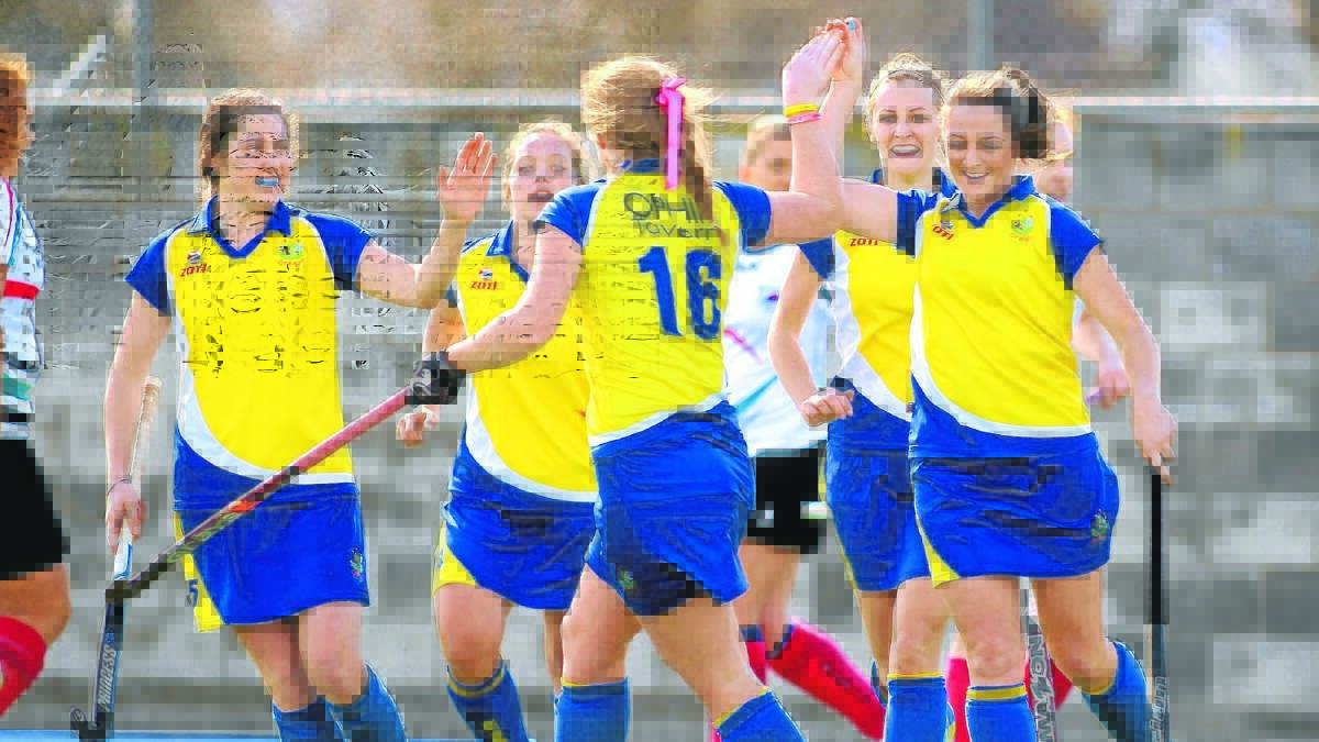 THIRD PLACE: Ex-Services players celebrate a goal in Saturday’s loss, which ended their 2015 women's Premier League Hockey season. Photo: PHIL BLATCH                                                                                                                                                                                               082915pnhockey12