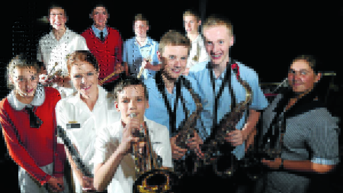 BANDING TOGETHER: (l-r) Georgia Beattie, Jacob McMullen, Able Seaman Laura McKinley, Curtis Bennett, Timothy Skrinnikoff, Noel Bartlett, Jonty Kingham, Michael Thompson, Mitch Anderson and Jordan Berry at a workshop between students from local high schools and members of the Royal Australian Navy Band at Orange High School yesterday. Photo: PHIL BLATCH                        1124pbband1