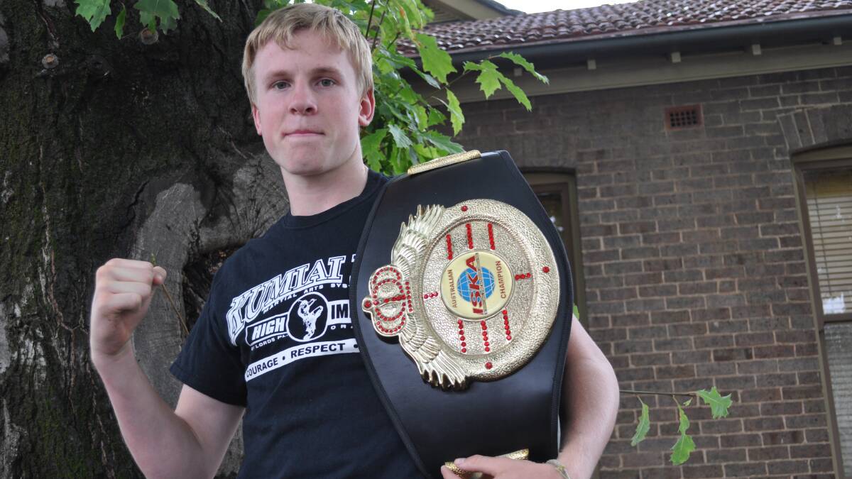 CHAMPION: High Impact fighter Charlie Bubb has retained his World Kickboxing Association (WKA) Australian super-welterweight title after a stellar five-round unanimous points decision win over Chris Chapman. Photo: NICK McGRATH                                                                                                                    0217nmbubb2