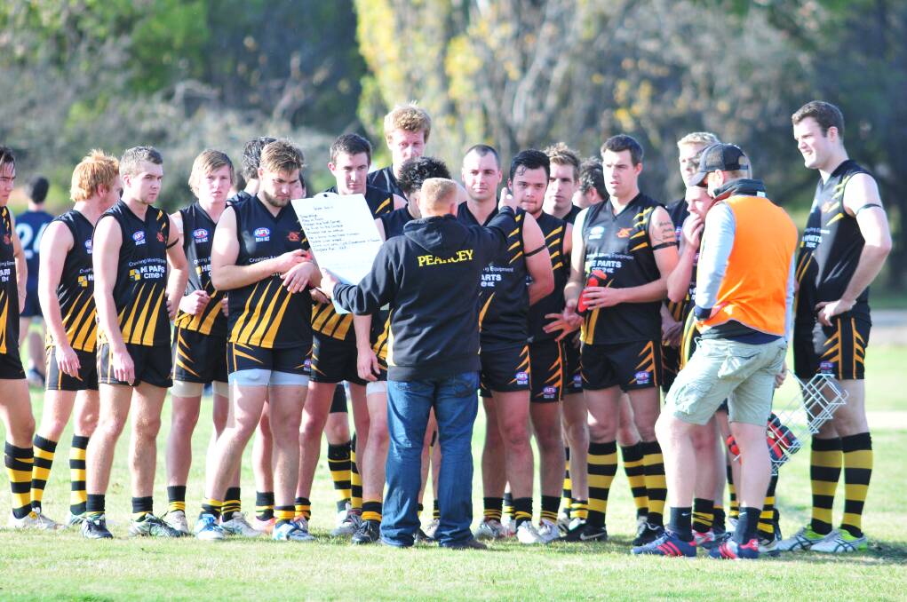 FROM THE FRONT: Orange Tigers coach Nathan Pearce lays down the law to the black and golds during the break in his side’s last clash. The Tigers travel to Bathurst on Saturday.
Photo: JUDE KEOGH 0531afl1