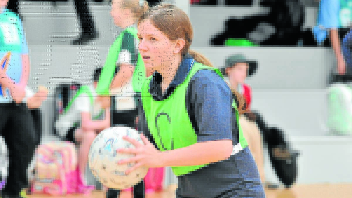 HAVING A BALL: Anson Street School's Jessie Kimm looks for a free teammate at Wednesday’s gala day at Orange PCYC. Photo: JUDE KEOGH                                                                                                                                                     0729pcycnetball1