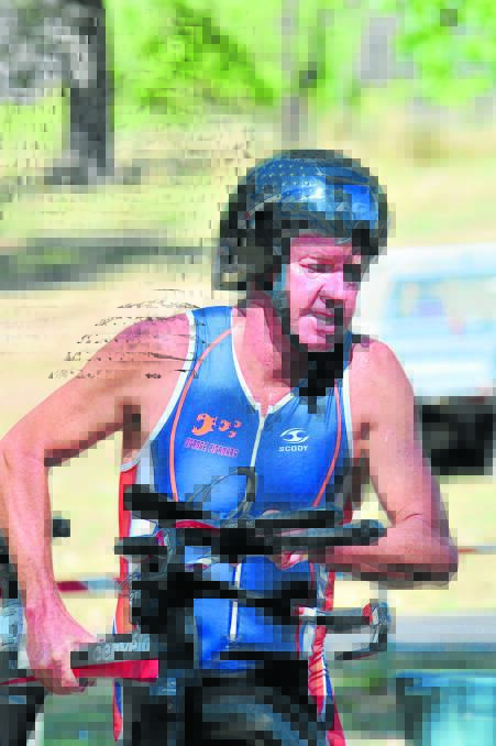 WATER WORLD: Phil Tudor will be in action for Orange at the final round of the 2013-14 Central West Inter-Club Triathlon Series in Mudgee. Photo: JUDE KEOGH                           0209tri9