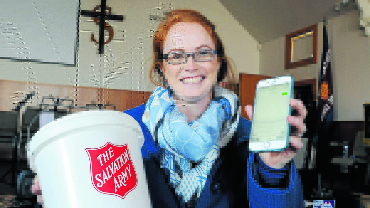 ANSWER SALVOS’ CALL: Emma Almond of Westpac will go door knocking in Orange this weekend as part of the Salvation Army’s Red Shield Appeal. People who miss the volunteers can, for the first time, donate to the Orange total by texting the word FOOD to a special number. Photo: STEVE GOSCH 0525sgsalvos3
