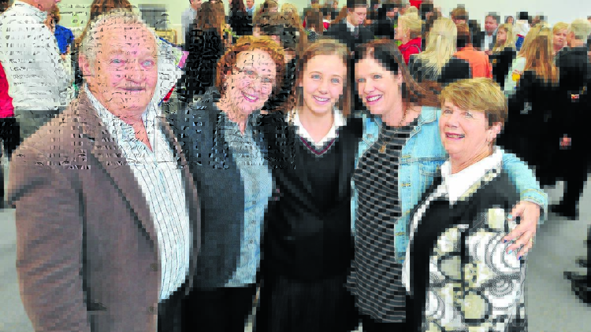 ALL GROWN UP: James Sheahan Catholic High school student Maddison Gillette (middle) has a full support crowd, including grandparents Len and Diane Gillette, mum Michelle and grandmother Margaret Sutton, to help her through her last day of school. Photo: JUDE KEOGH                                     0919jshs5