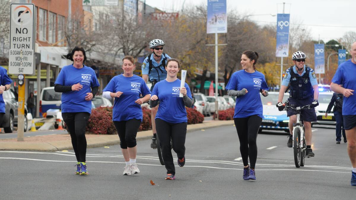 PASSING THE BATON: Melissa Atkins, Leading Senior Constable Jo Little, Senior Constable Belinda Bastock and Senior Constable Michelle Cook followed by Constable Tom Martin and acting Sergent Leon Lincoln. Photo: STEVE GOSCH