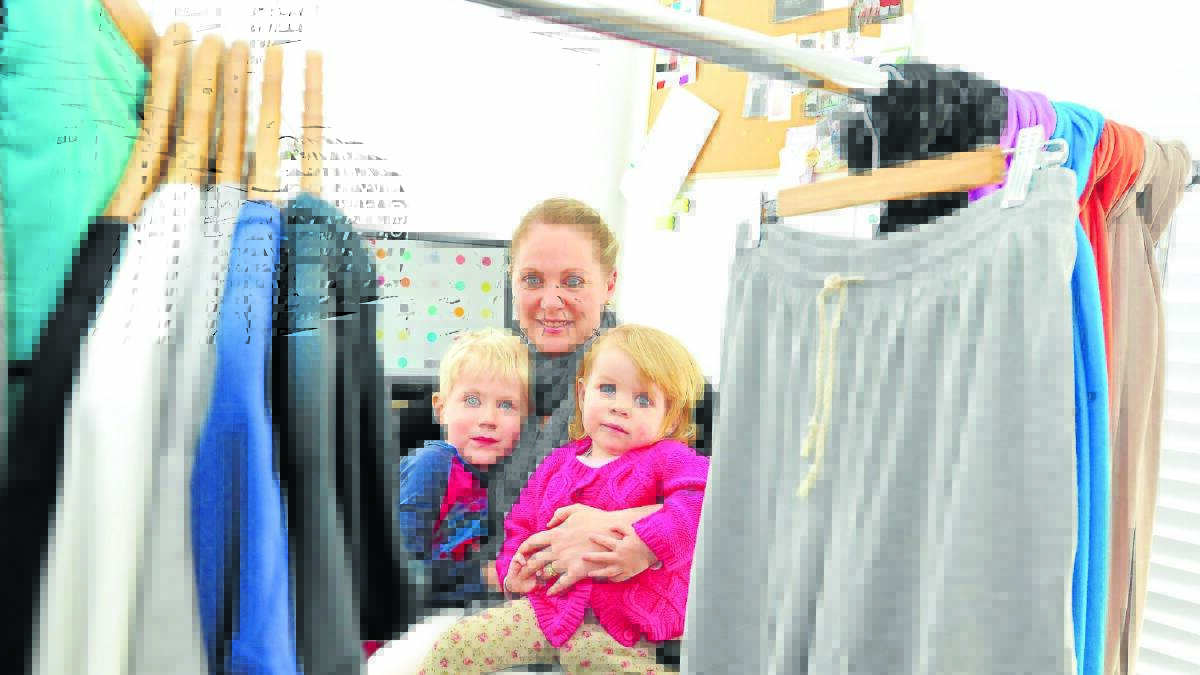 SUPERMUM: Young mother, entrepreneur and business owner Banika Smee with her two children Madwick, 5, and Bilijana, 2. Mrs Smee has been nominated in the Aus Mumpreneur and Telstra business woman of the year awards for her online and wholesale bamboo clothing business.
Photo: MARK LOGAN 0727mum1