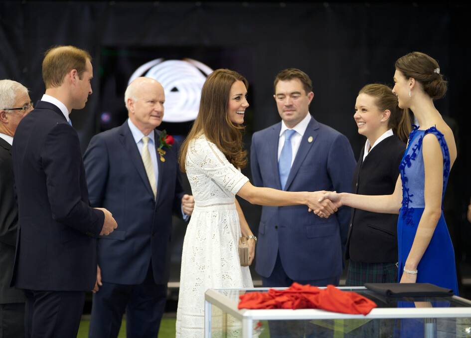 ROYAL SEAL OF APPROVAL: Prince William, Duke of Cambridge, and Catherine, Duchess of Cambridge, meet Stephanie Fields modelling the dress Kinross Wolaroi School student Sophie Aylward (second from right) designed. Royal Agricultural Society of NSW vice-president Robert Ryan and Australian Wool Innovations media manager Marius Cuming look on. Photo: WOLTER PEETERS/FAIRFAX MEDIA