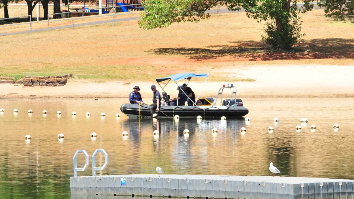 HOLIDAY TRAGEDY: Police search Lake Canobolas on Monday for the body of missing backpacker Arvid Stenzel . His body was recovered yesterday morning. Photo: LUKE SCHUYLER  0210LSRESCUE7