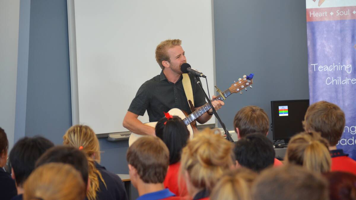 GOING WITH GOD: Country music singer Jared Porter captivated students at Orange Christian School as he sung and reminded them to always remember where they came from.
Photo: NICOLE KUTER 0207nkjared6
