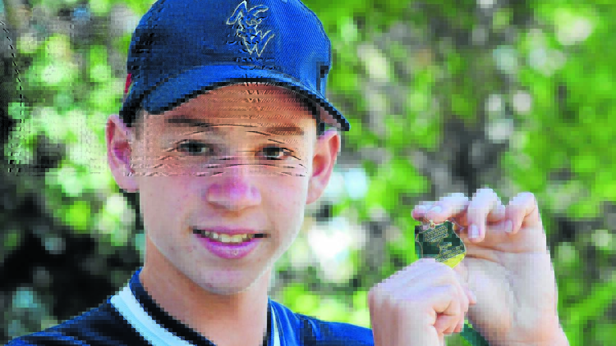 GOLDEN BOY: Orange's Tom Zeylemaker shows off his gold medal from the Softball Australia boys' under-17 championships. Photo: STEVE GOSCH                                                           0129sgsoftball1