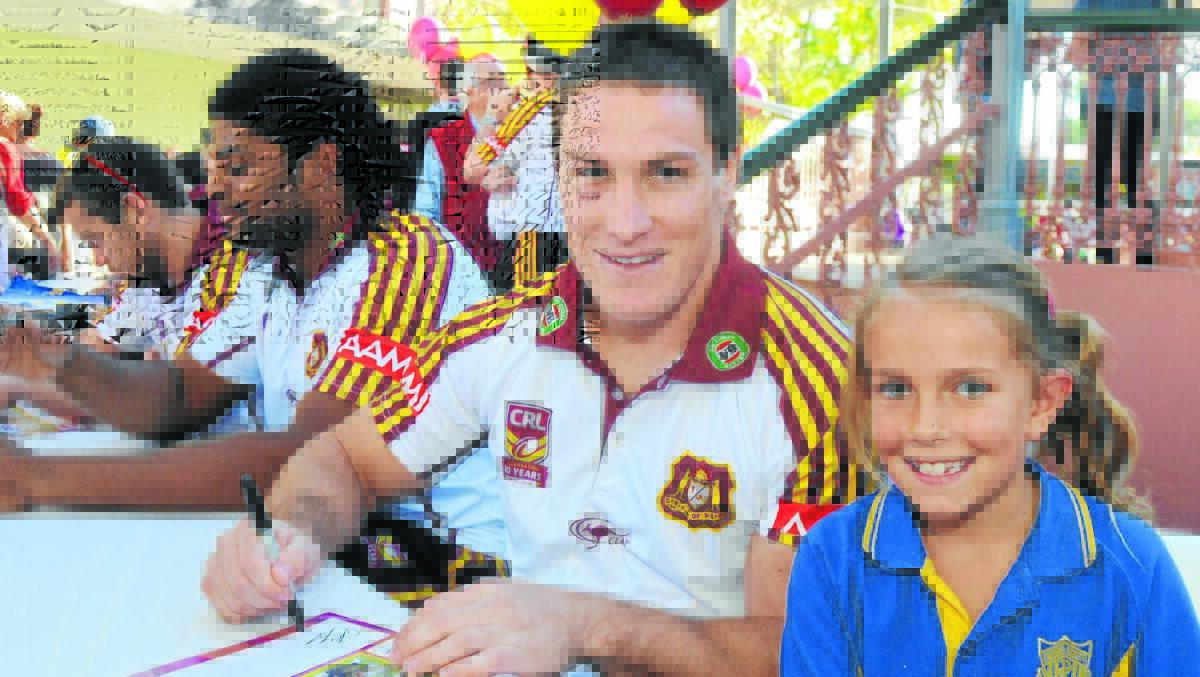 UP CLOSE AND PERSONAL: Country’s Josh Jackson signs an autograph for Dakota Ryan in Dubbo on Thursday. Photo: BELINDA SOOLE