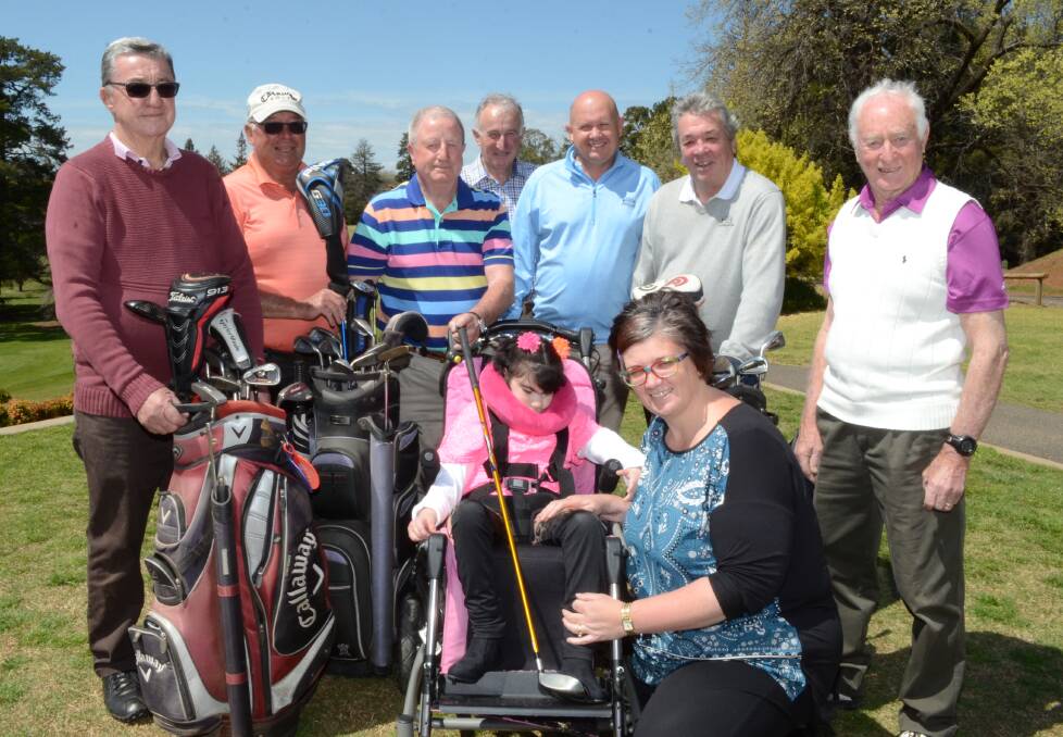 ON COURSE FOR A CAUSE: Duntryleague Golf Club members Joe Gander, Peter Smith, Tony Leahey, Rob Walker, Jamie Ash, Alan Davis and Barry Keen (back) with Kyah Lucas and Sandra Wicks who are looking forward to a fundraising golf day on Friday. Photo: JUDE KEOGH 0930kyah3