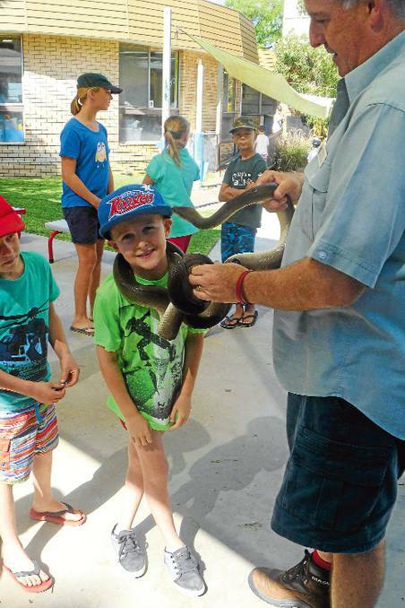 NARROMINE: Dane Burns bravely handles a snake at Vacation Care.