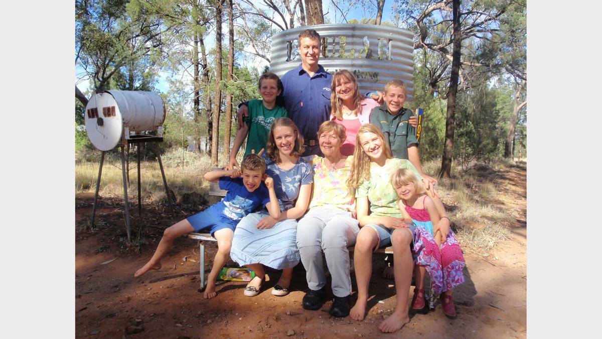 PARKES: The Kelly family at the entrance to their property on the outskirts of Trundle. From left, back are Simeon (11), Peter and Jen Kelly, Matthias (13); front, Reuben (6), Lydia (17), Aileen Norman (Jen’s mum), Eliza (15) and Carmel (4).