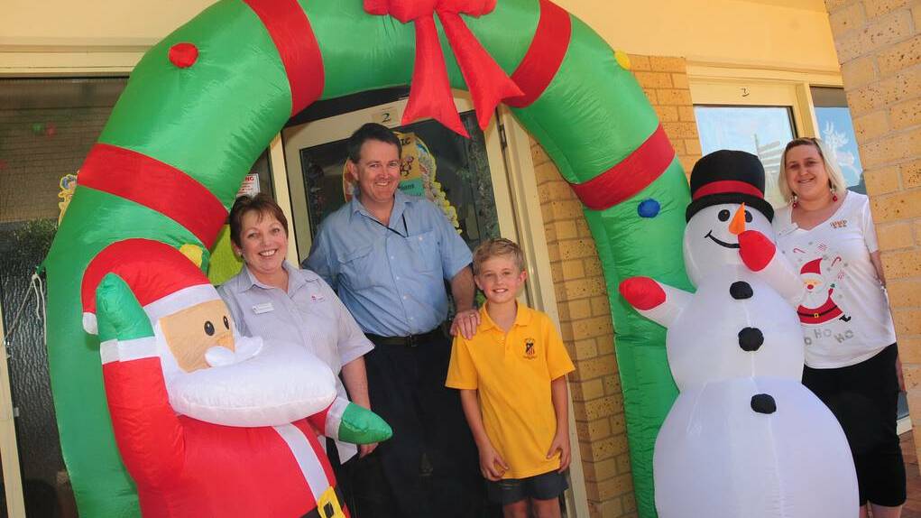 DUBBO: Pat Bacon, Dr Dominic FitzGerald, Billy Burden, and Danielle Shuttle soak up the "Christmas crazy" atmosphere.