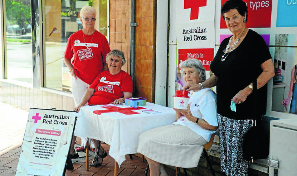 PARKES: At the collection point in front of the Parkes Red Cross Centre during the appeal last Saturday were from left, Barbara Scott, Zelma Fisher, Gloria Dietrich and donor, Bernice Lovelock. Photo: Renee Powell.