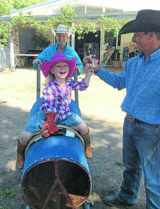 FORBES: Organisers of the Forbes Rodeo Shaun and Troy Read took their makeshift bull to Forbes Preschool, where Beth Cannon enjoyed the ride