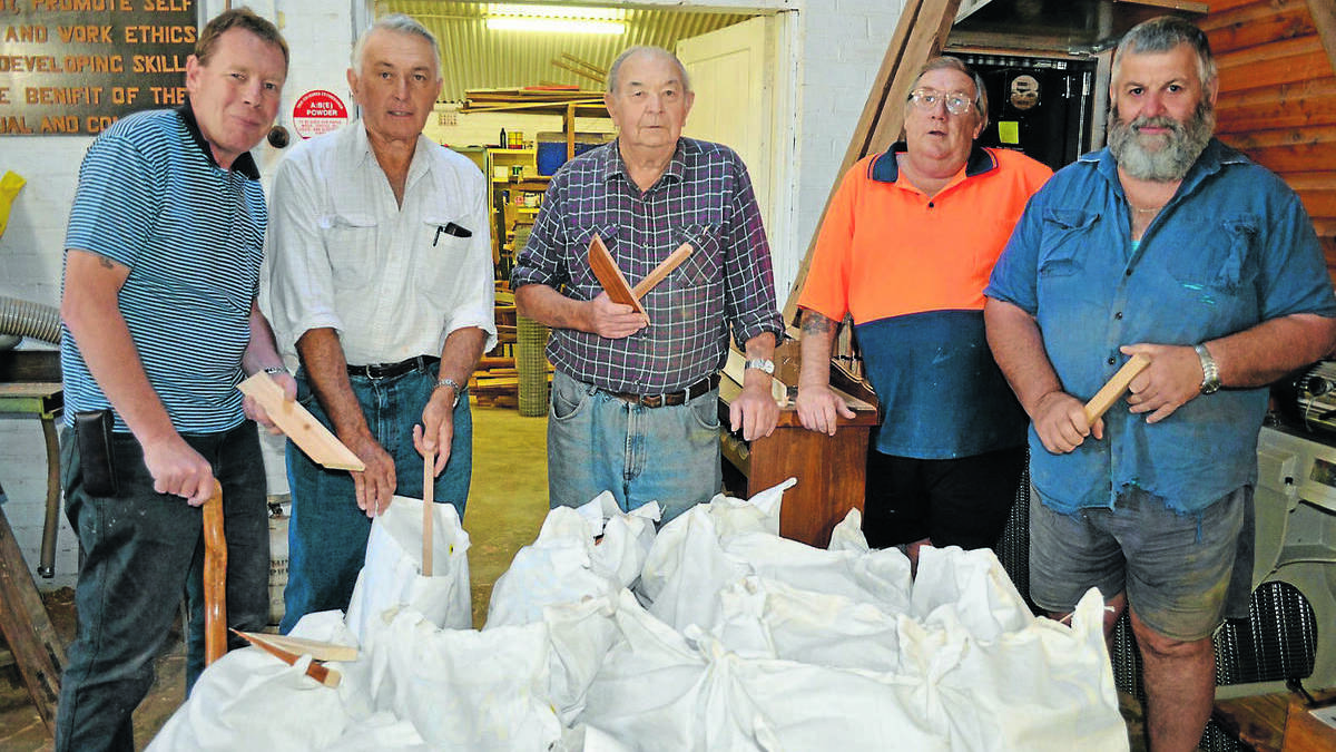  FORBES: Forbes Menshed members Carl Dagger, president Norm Haley, Ken Reid, John Stacey and Bill Little are selling bags of kindling for $10.