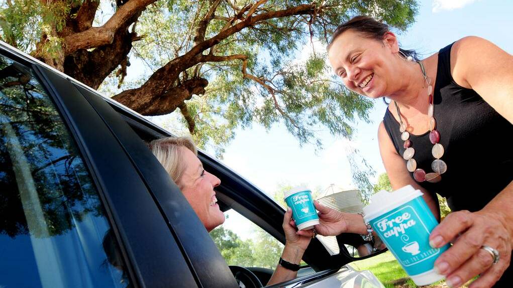 DUBBO: Jayne Bleechmore, road safety officer for Gilgandra, Wellington and Dubbo, receives a free cuppa from Suzanne Grattan of Dundullimal Homestead as part of the program. Photo Louise Donges