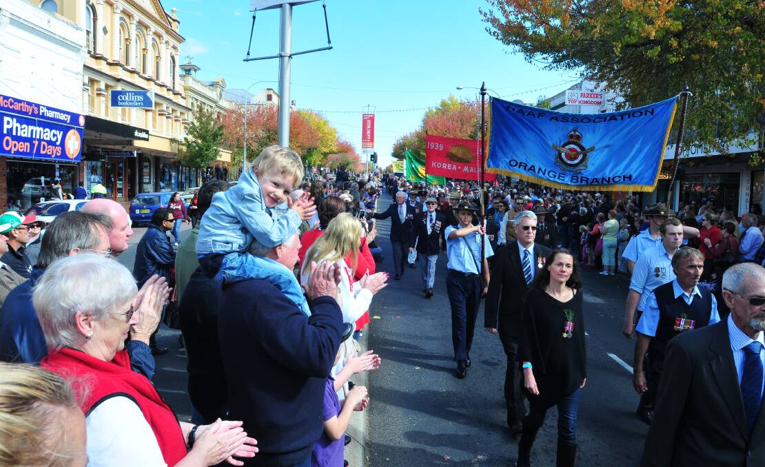 ANZAC DAY: Crowds support the march.