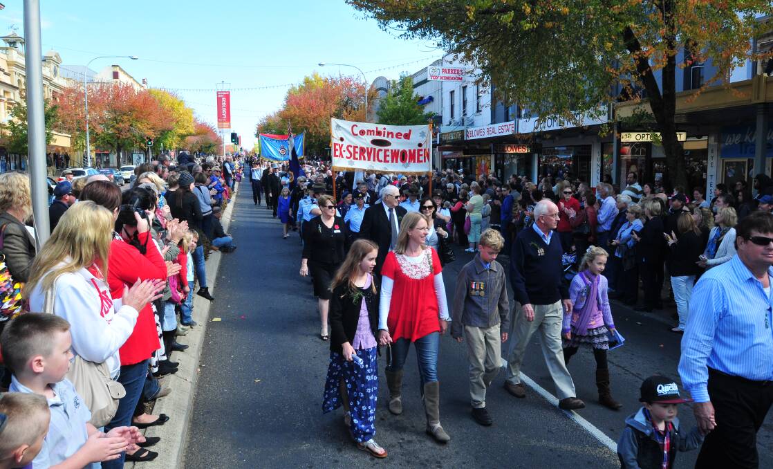 ANZAC DAY: Crowds support the march.