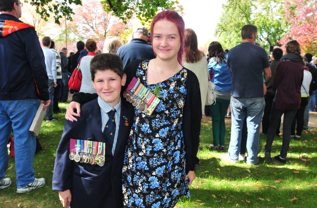 ANZAC DAY: Bailey Cole and Chloe Morgan marched for Les Frost