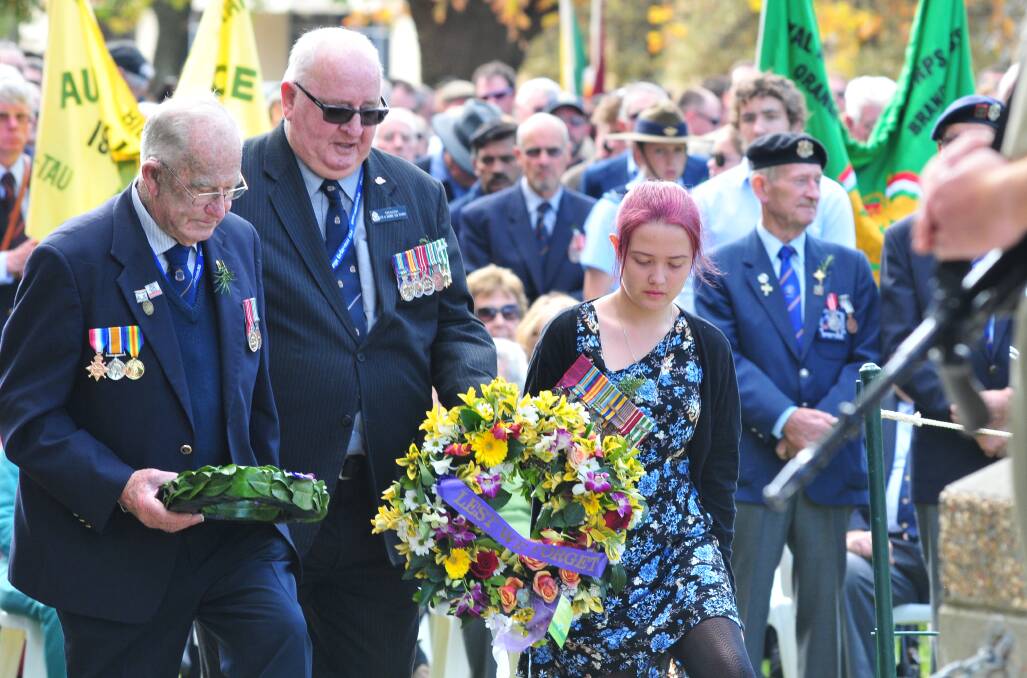 ANZAC DAY: Les McGaw, Lindsay Wright with Chloe Morgan the neice of Les Frost.