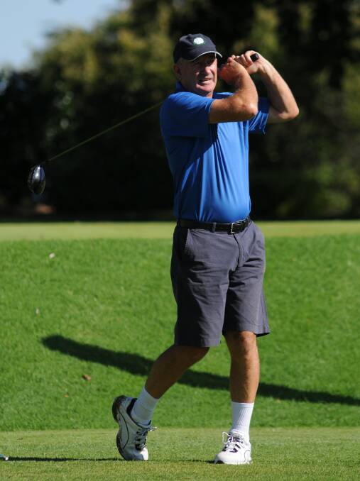 LONG DRIVE: Neil Rutherford, of Bermagui, watches his drive on the first at Duntryleague on Tuesday. Photo: STEVE GOSCH 0303sggolf1