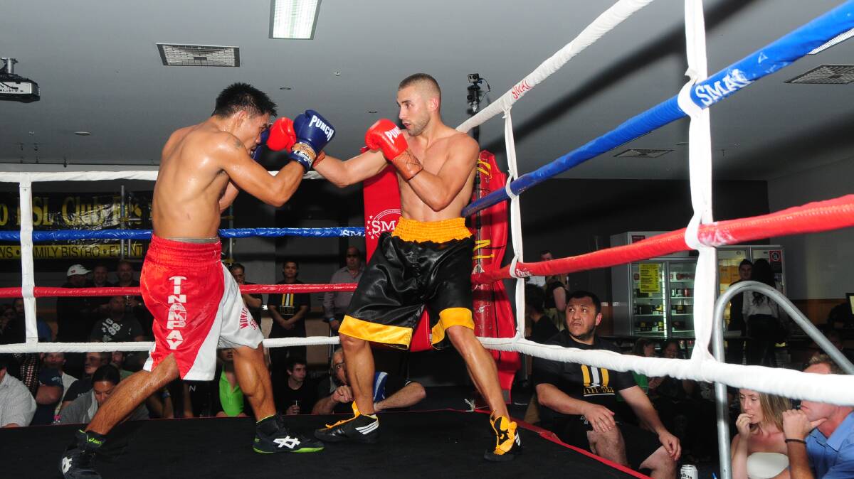WE MEET AGAIN: Arnel Tinampay (left) and Sam Ah-See (right) in the ring n the main event of the Black Money fight night in Dubbo in 2013. Photo: LOUISE DONGES