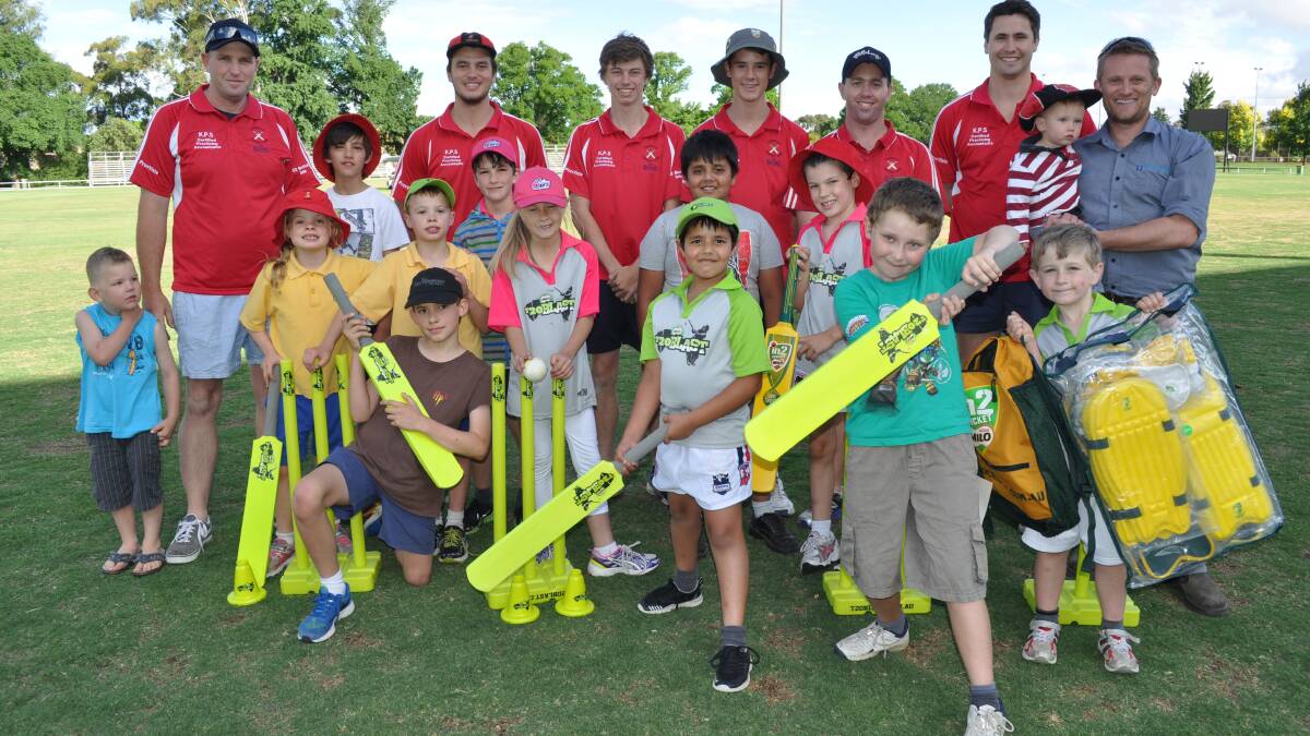 BACK IN BLACK, AND RED: Centrals seniors join the club's budding juniors, issued with brand new cricket Australia T20 blast gear, as the red and blacks build towards the future. Photo: NICK McGRATH 1212nmcentralsjunior