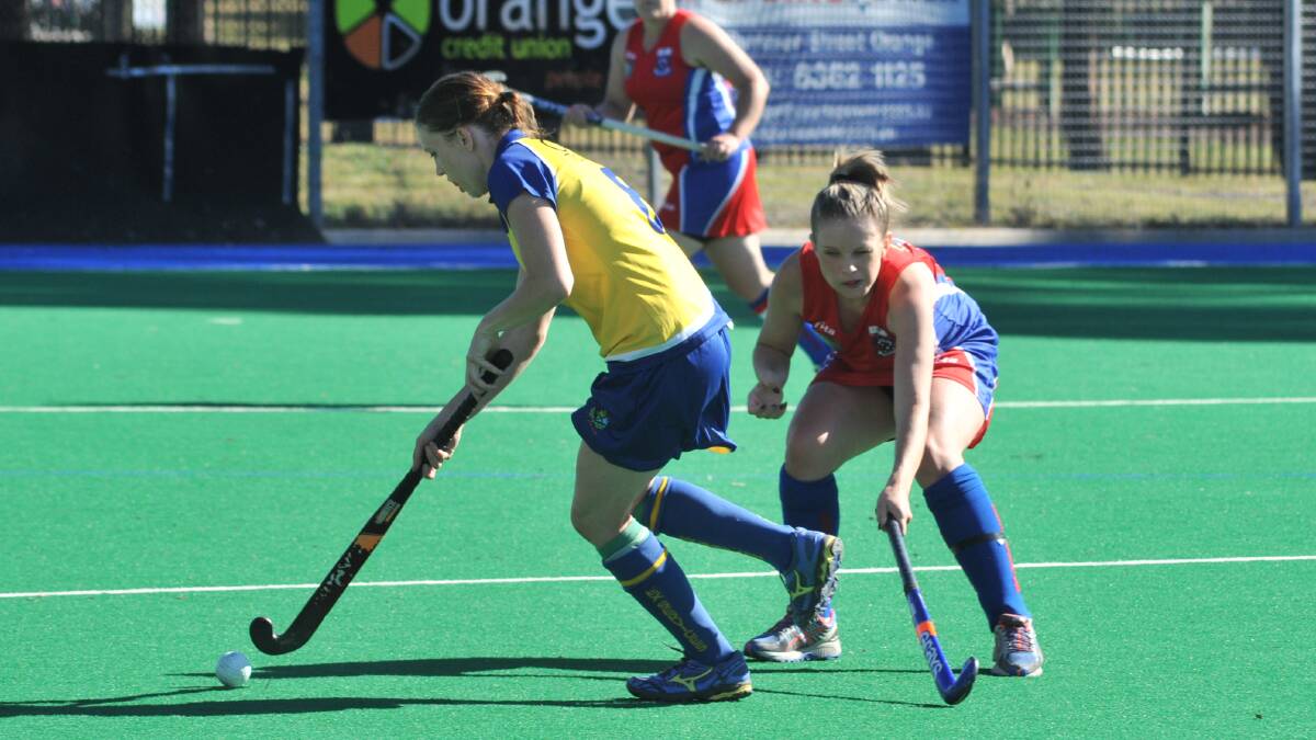 WE'RE COMING: Shian Duboc and her Ex-Services teammates have no shortage of motivation in Saturday's women's PLH game against Souths. Photo: JUDE KEOGH 0319womhock5