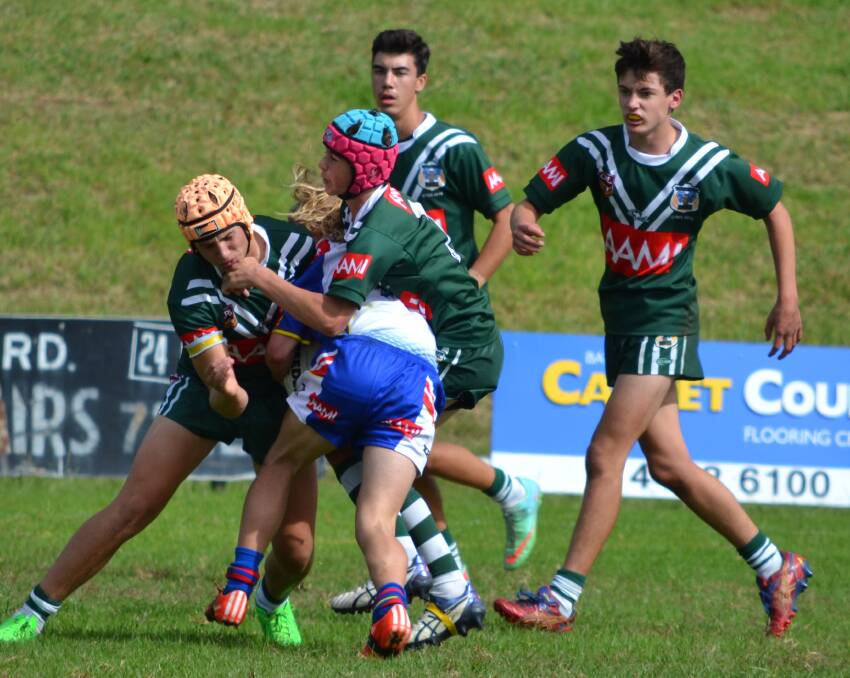 RAM IT HOME: Lincoln Monk (orange headgear) and Josh Board (pink and blue headgear) are two of five Orange CYMS starters in the Rams' under-16 semi-final on Saturday. 