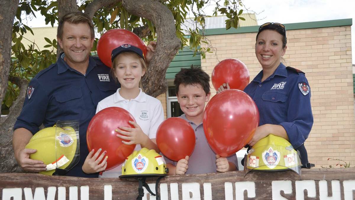 LITHGOW: Cooerwull’s Renae Dukes and Shamus Kearney bring out the balloons in appreciation of firies Darryl Goodwin and Mel Palmer. lm022014daz
