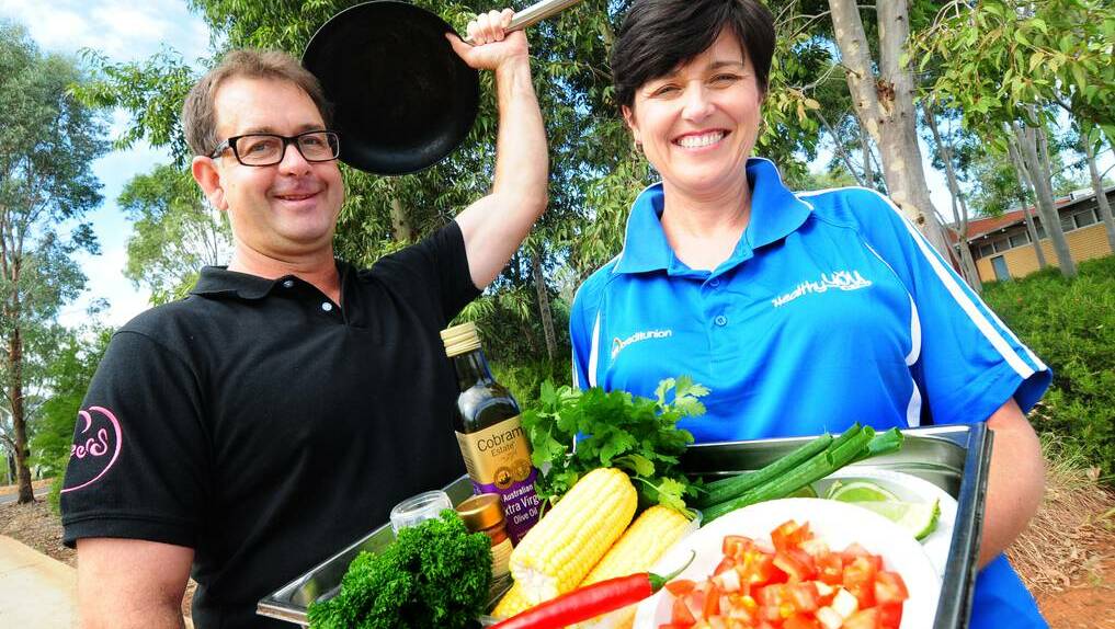 DUBBO: CSU Dubbo Food and Beverage Service manager Brett Russell preparing for his cooking demonstration with CSU Work Health and Safety acting manager Melissa Lombe.