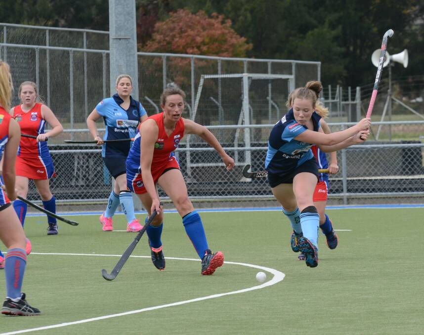 CRACK: Souths' Sarah Watterson lines a shot up in Saturday's win against Confederates. Photo: PHILL MURRAY 051014psouths4