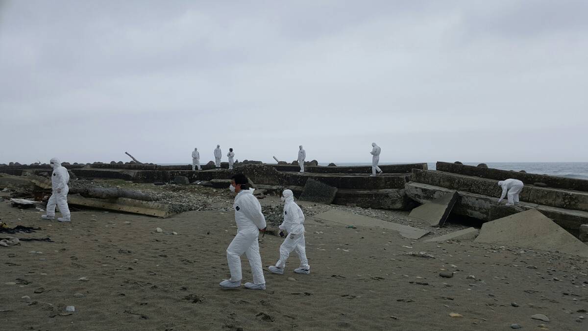 EERIE: Bathurst delegates in protective clothing take a sombre walk through the desolate landscape left behind by the Fukushima nuclear disaster, which took place five years ago on the outskirts of Bathurst’s sister city of Ohkuma, Japan. Photo: WARREN AUBIN 	042116radioactive1