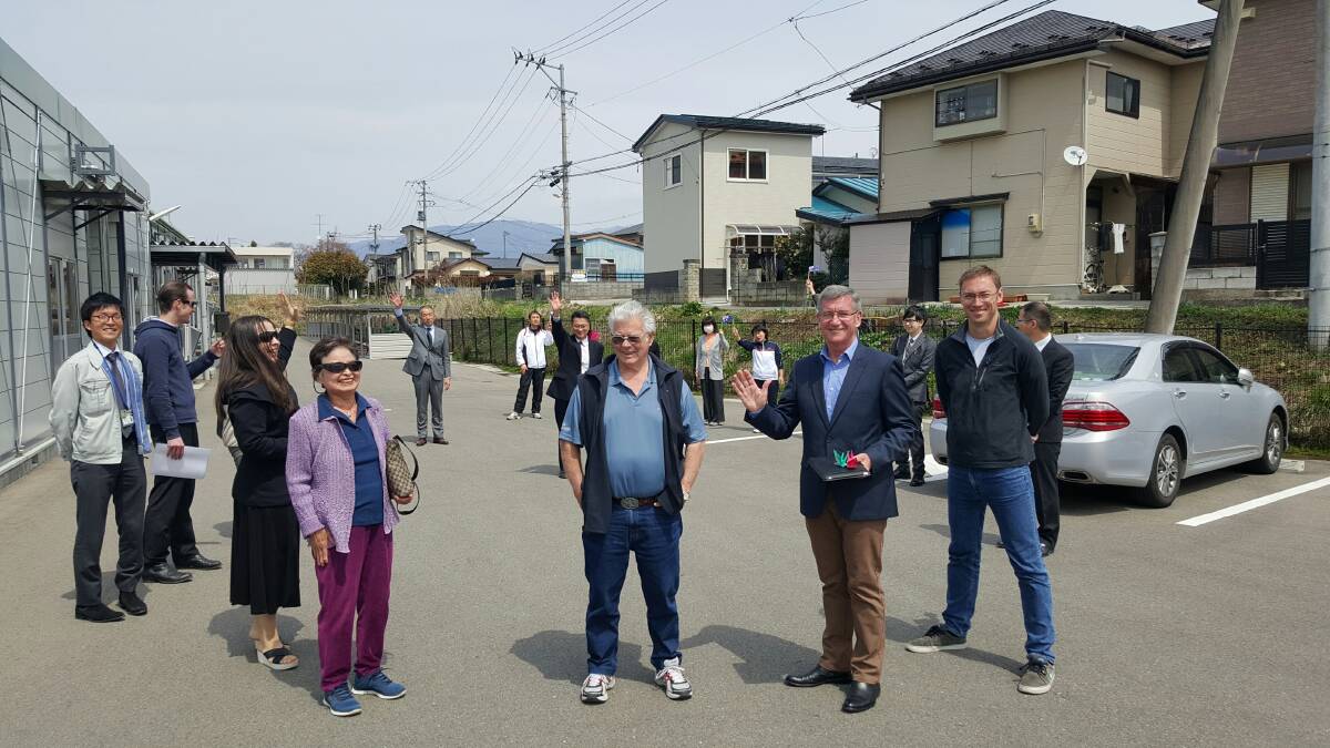 FRIENDS ALWAYS: Members of the Bathurst delegation including Dr Teo Todorova, Fudeko Reekie, Norm Mann, mayor Gary Rush and Ardin Beech wave farewell to some of the people who have been relocated to Aizu. Photo: WARREN AUBIN	042116radiation3