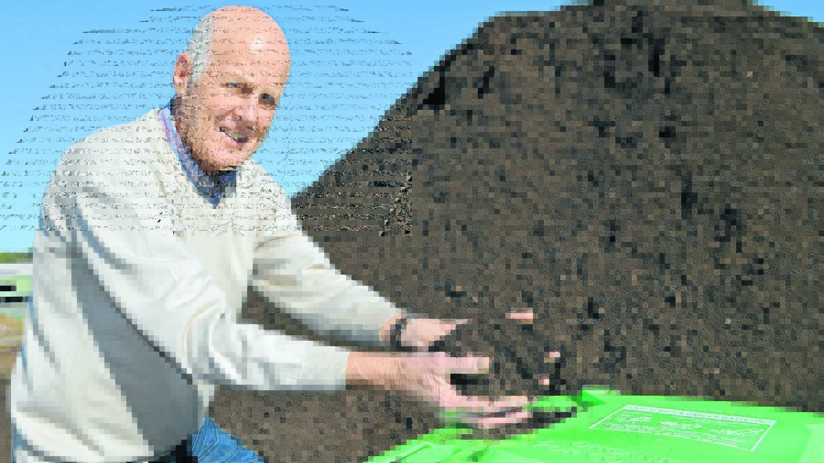 STEAMING PILE: After the first 12 months of turning kitchen and garden waste from green-lidded bins into compost, Cr Neil Jones is delighted at the way Orange residents have embraced the service