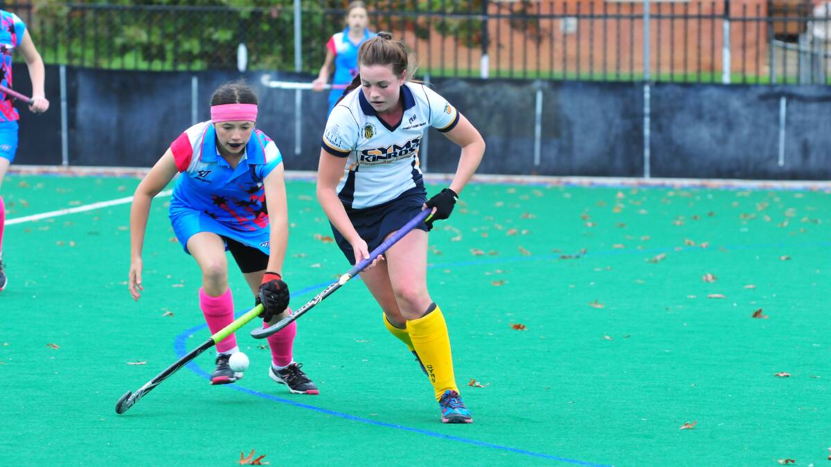 STAR PERFORMER: Despite missing the play-offs, Kinross-CYMS' Madie Smith (right) was one of Orange's best at the NSW Hockey Open Women's Field State Championships. Photo: JUDE KEOGH 0426womhock1