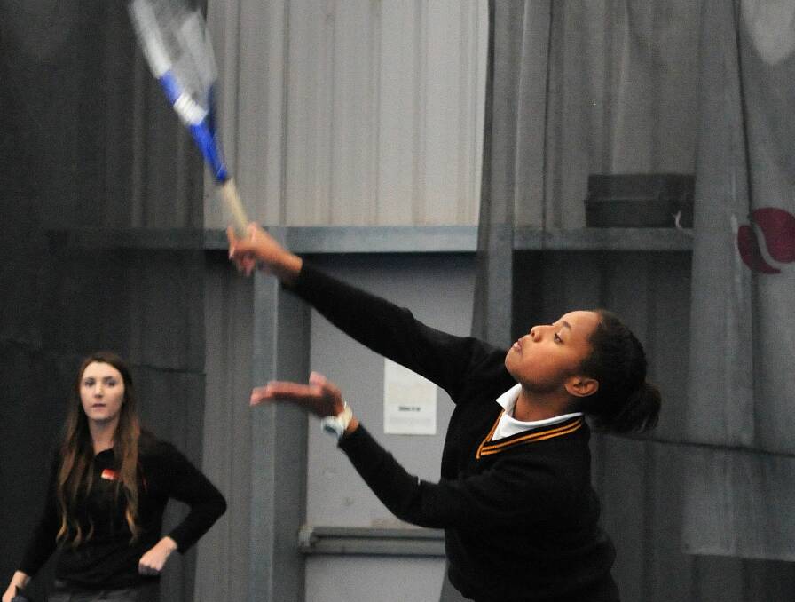SERVE IT UP: Orange High's Mil Tui bangs a serve down in her school's massive 15-1 win over Dubbo College. Photo: STEVE GOSCH